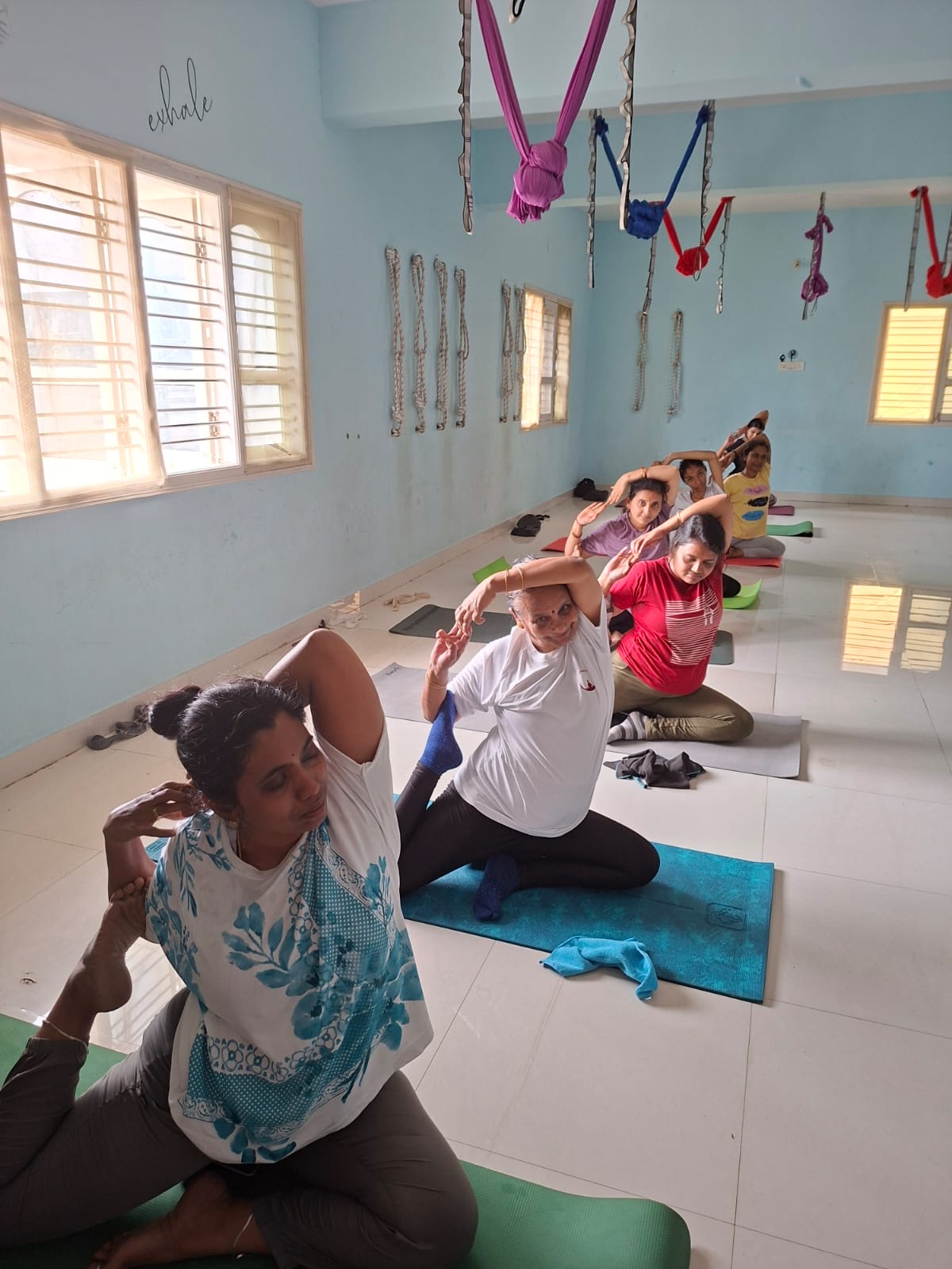 Students in a seated backbend at Astral Space Yoga